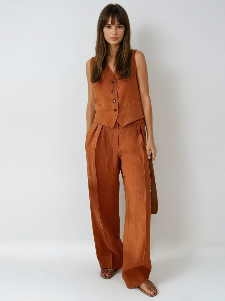 Chic women's cotton linen two-piece set. Features a summer waistcoat and wide-leg trousers for resort wear.