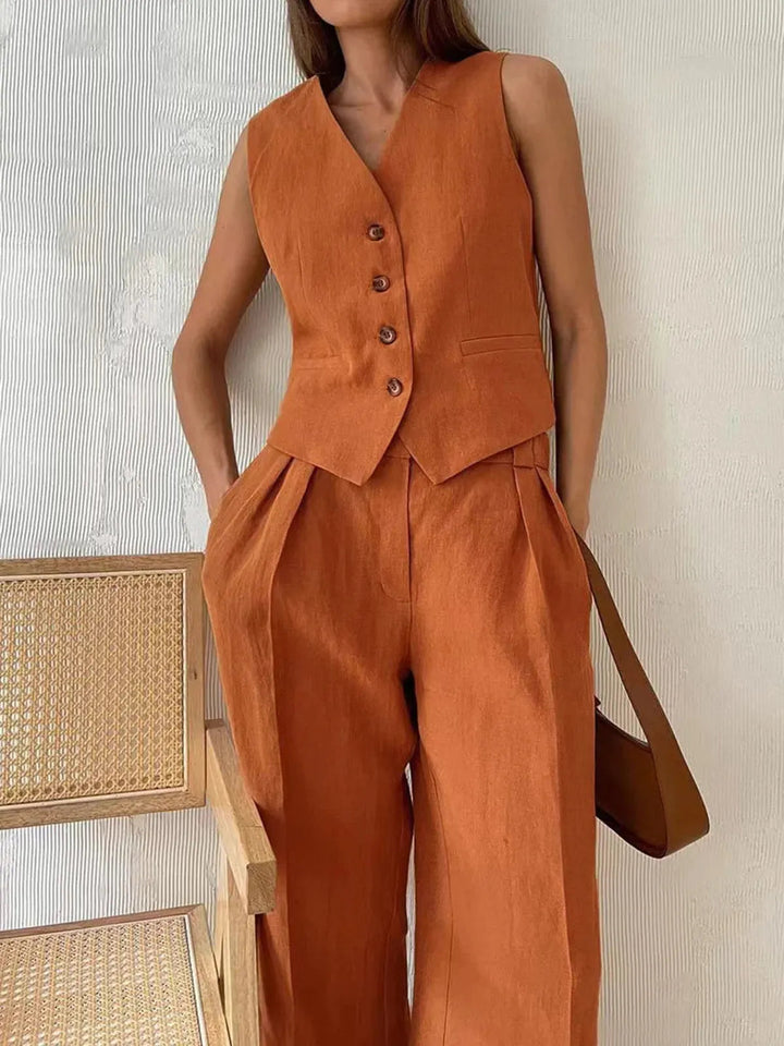 Elegant women's summer outfit: cotton linen waistcoat and wide-leg trousers set. Ideal for resort or casual chic.