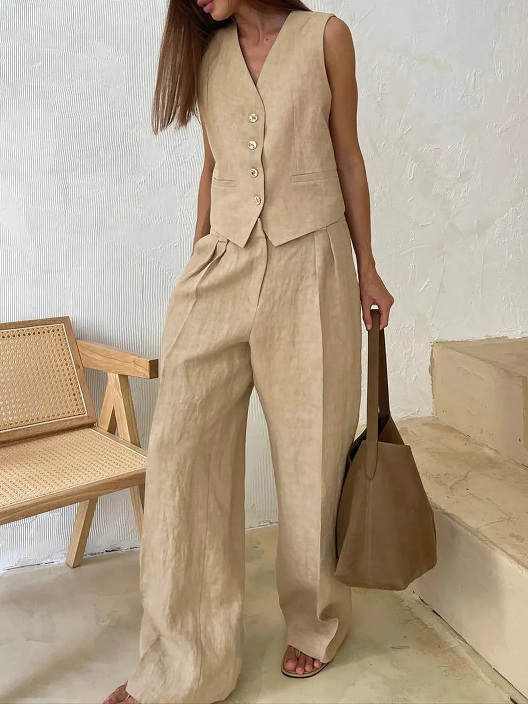 Versatile women's cotton linen set with a stylish waistcoat and wide-leg trousers. Great for summer resort wear.