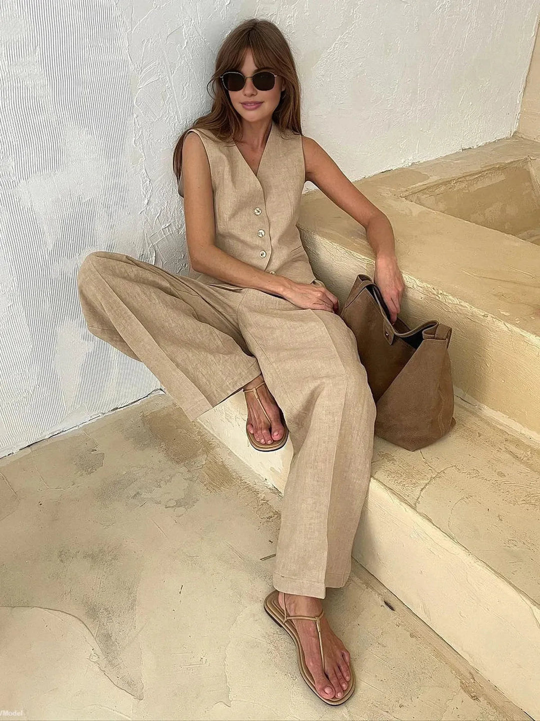 Casual yet chic women's linen blend two-piece set, featuring a waistcoat and comfortable wide-leg trousers.