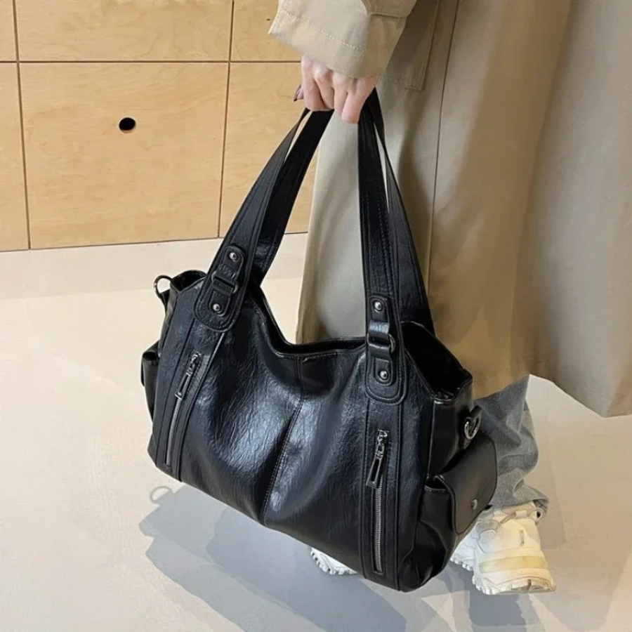 Chic women's faux leather shoulder duffle bag for everyday style.