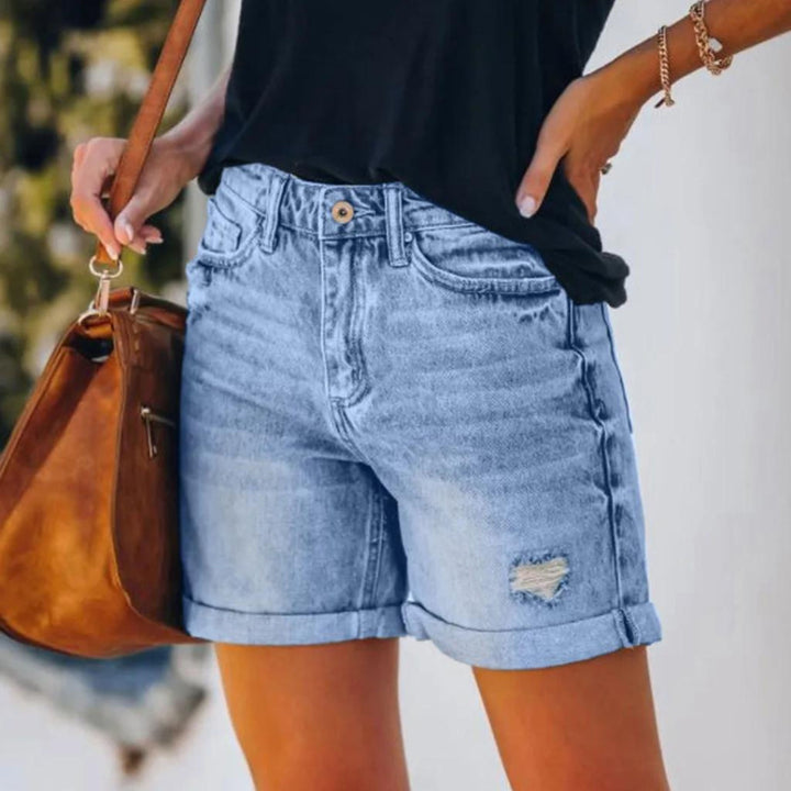 Stylish blue high waist shorts for women, featuring a comfortable fit for elegant summer fashion looks.