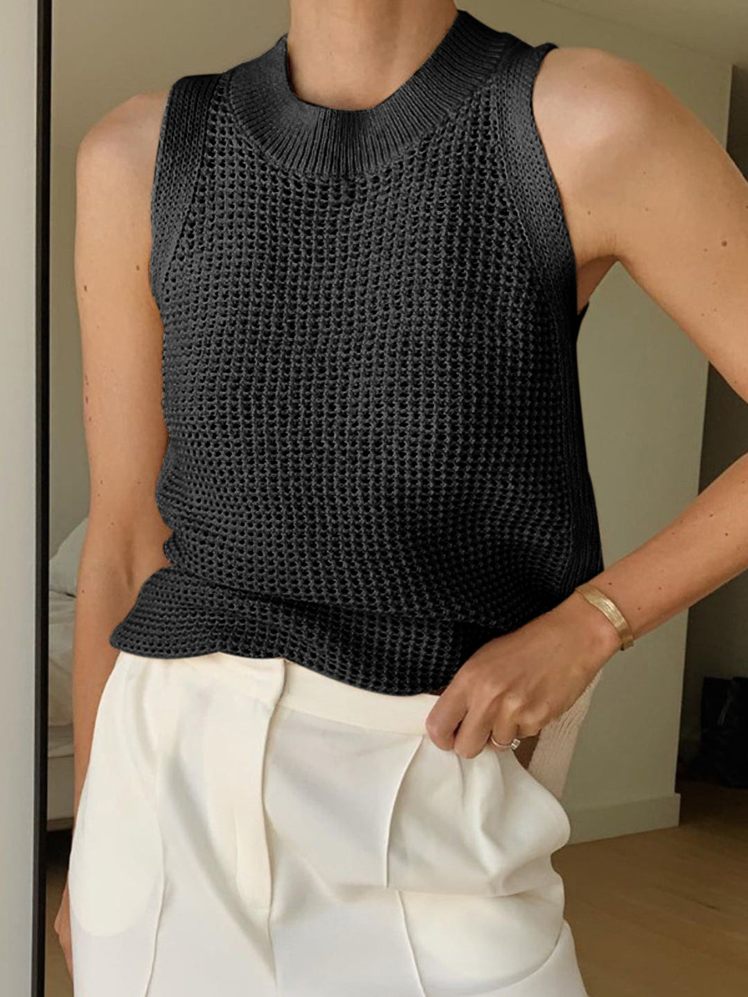 Textured hollow knit sleeveless top for women, designed for a chic, breathable fit ideal for summer fashion.