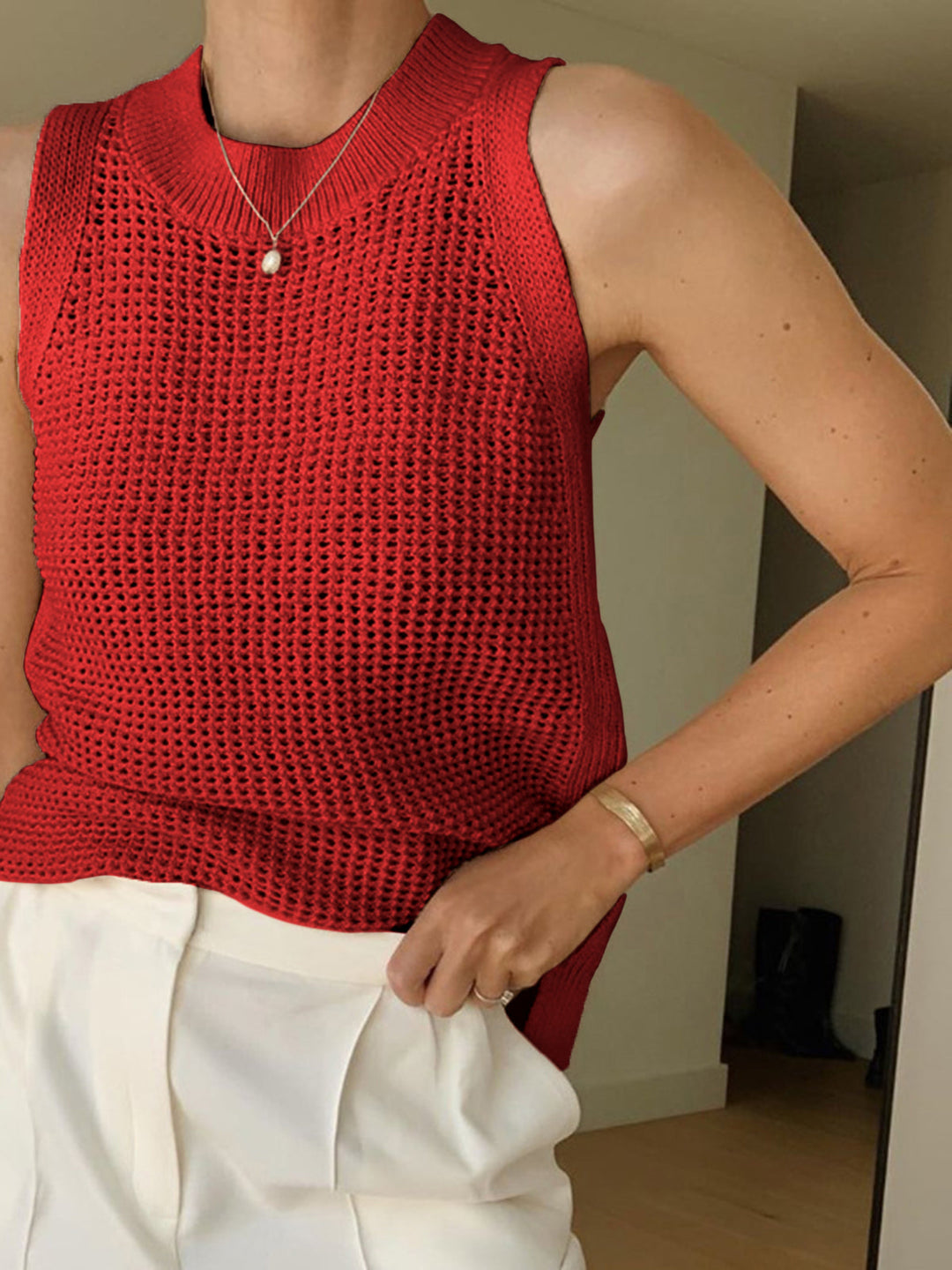 Versatile women's chic hollow knit tank top, featuring a unique textured design for summer and casual outfits.