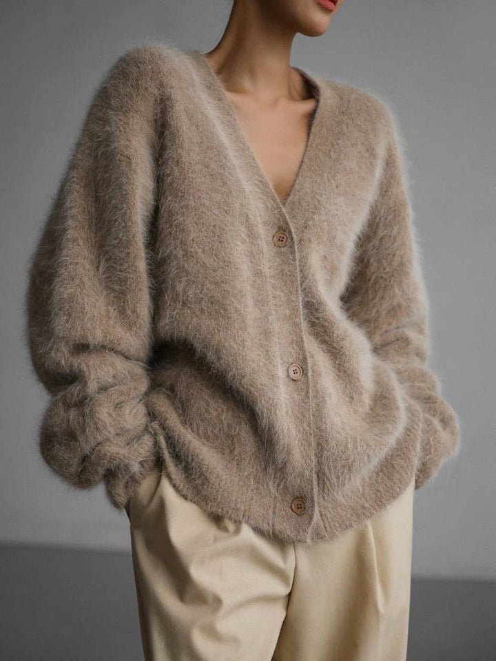 Relaxed fit women's oversized button-up cardigan for cozy fall & winter layering. Stylish casual long sleeve comfort.