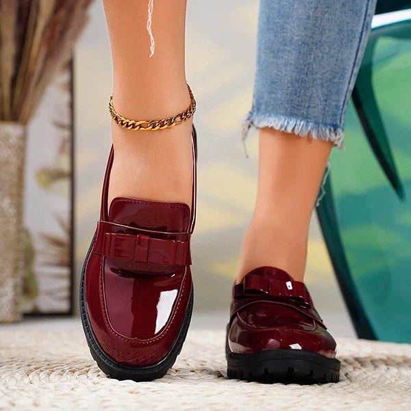 Black women's platform loafers with a chic bow, perfect casual elegant dress shoes for any occasion.