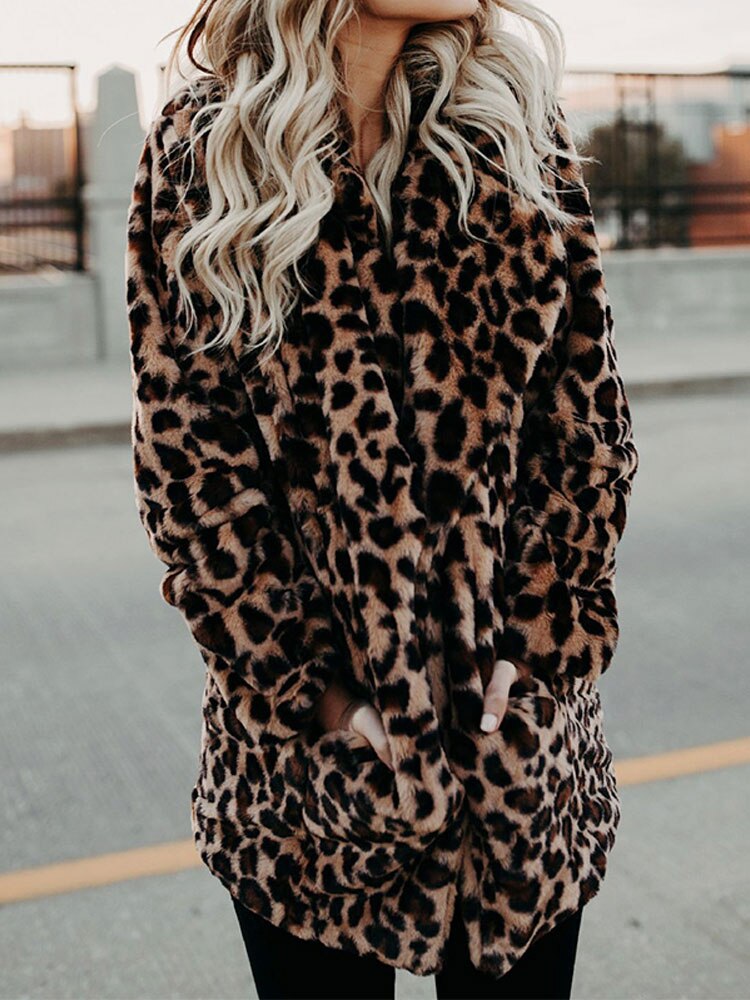 Fashion-forward women's leopard print statement coat. This Sofia winter jacket offers chic style and warmth.