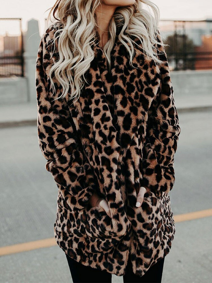 Fashion-forward women's leopard print statement coat. This Sofia winter jacket offers chic style and warmth.