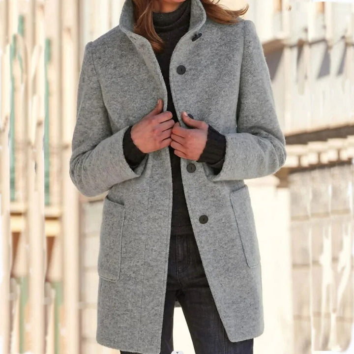 Chic women's winter overcoat, long & warm, perfect for stylish cold weather outerwear. Features classic button front.