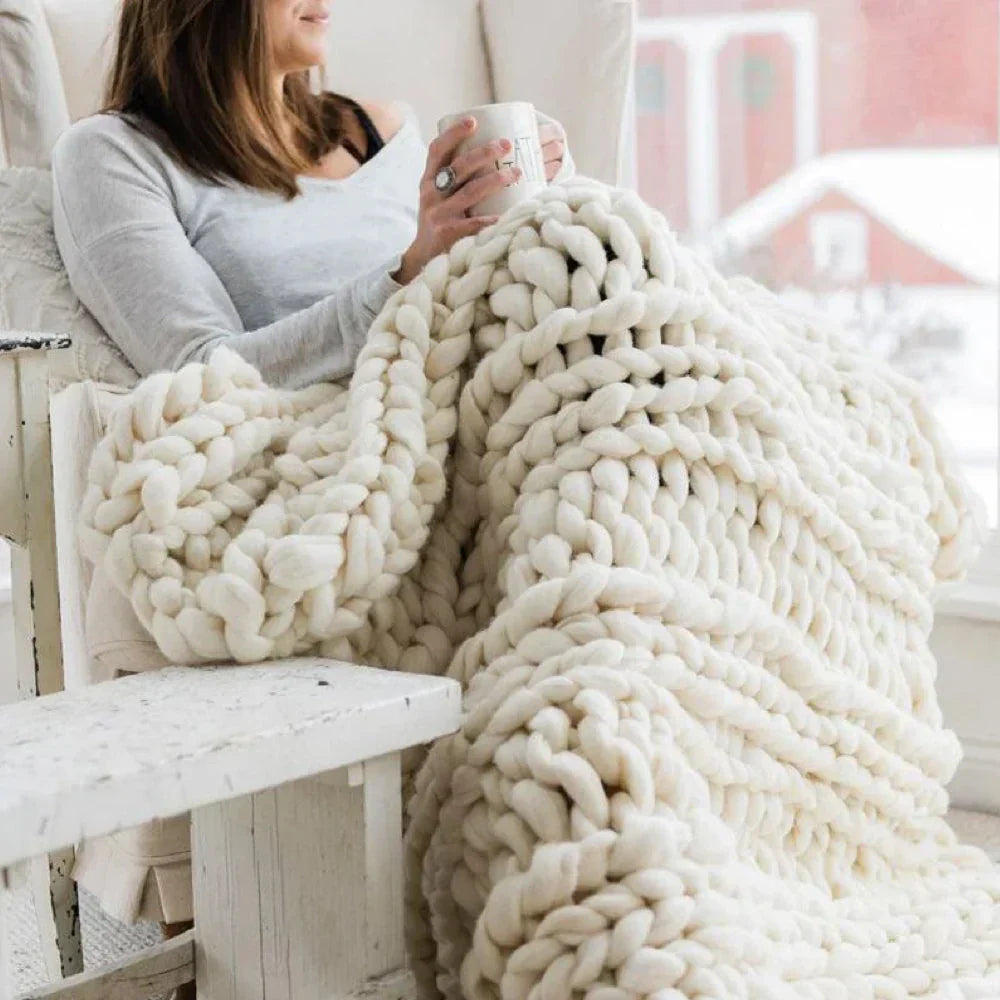 Large spool of chunky wool yarn (2.2 lb) for making ultra-soft blankets and throws.