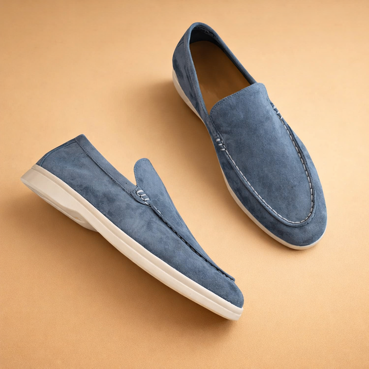 Classic black men's slip-on penny loafers, elegant & comfortable for everyday wear.
