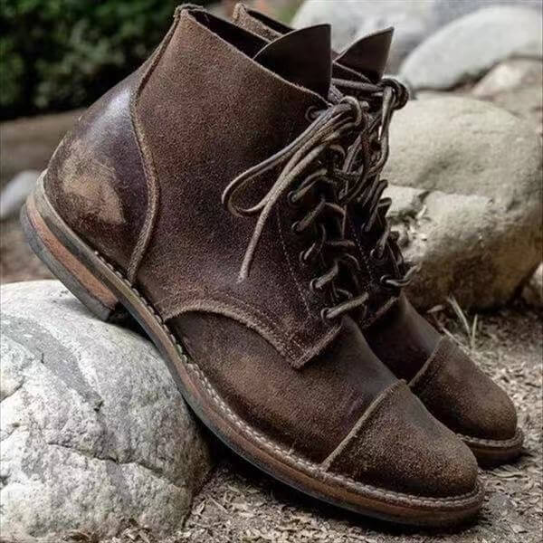 Classic brown leather men's boots, durable & comfortable. Versatile footwear for casual or formal occasions.
