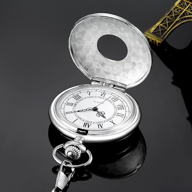 Hand holding a sophisticated men's Roman numeral pocket watch, highlighting its classic vintage charm.