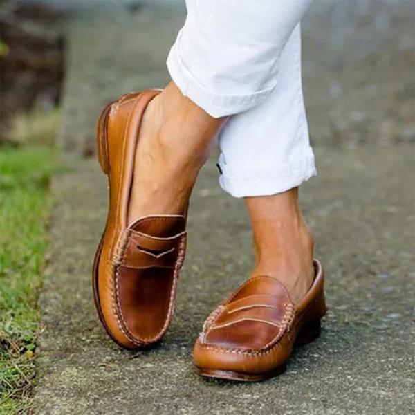 Classic women's slip-on loafers in black, perfect for effortless work or everyday chic style & comfort.