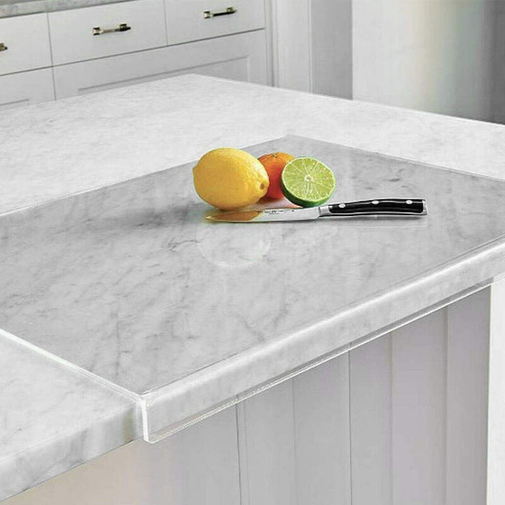 Clear non-slip acrylic cutting board with sturdy feet for hygienic kitchen food prep & chopping.