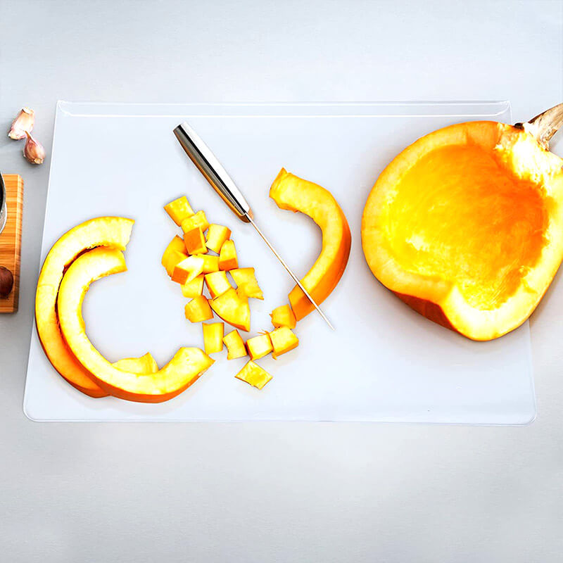 Non-slip acrylic cutting board ensures stability during kitchen food prep, hygienic & durable for chopping.