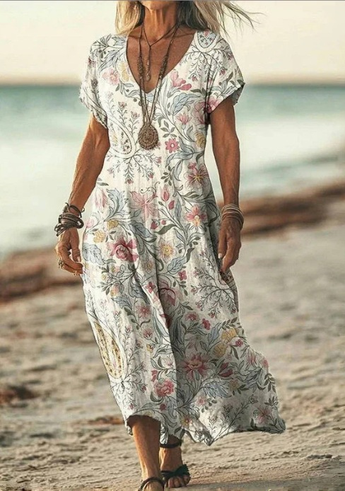 Close-up of the elegant floral print on a women's midi dress, perfect for summer.