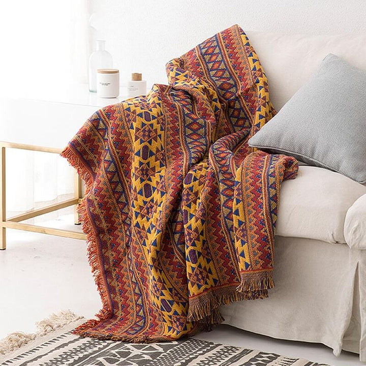 "Colorful bohemian tassel knitted sofa throw, featuring bright patterns and ethnic tassel details for vibrant home decor."