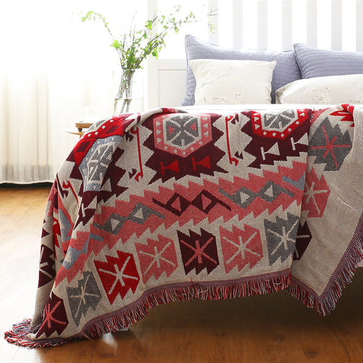 "Colorful bohemian tassel knitted sofa throw, featuring bright patterns and ethnic tassel details for vibrant home decor."
