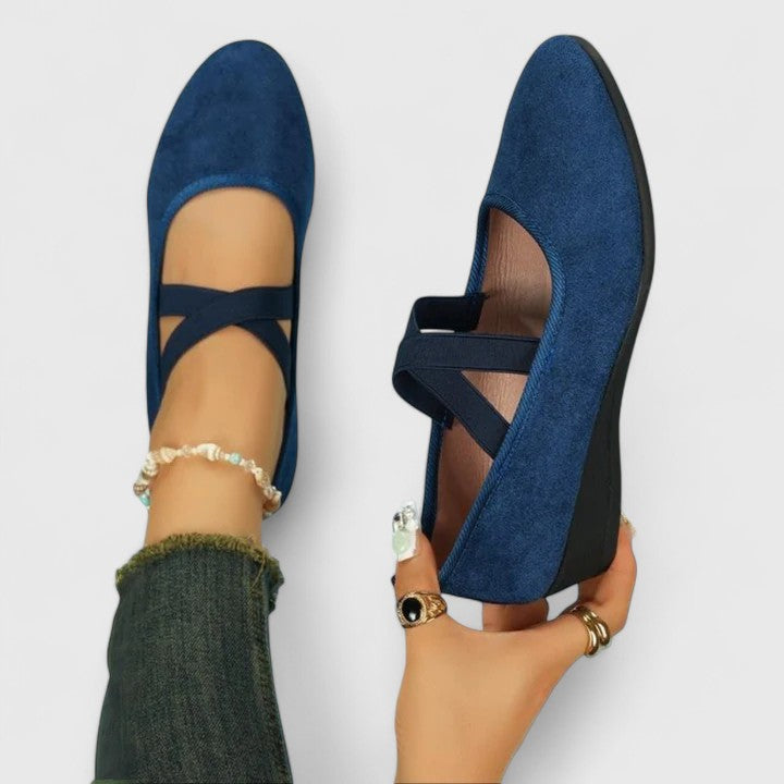 Stylish women's ballet shoes featuring elegant cross straps, ideal versatile footwear for ladies.