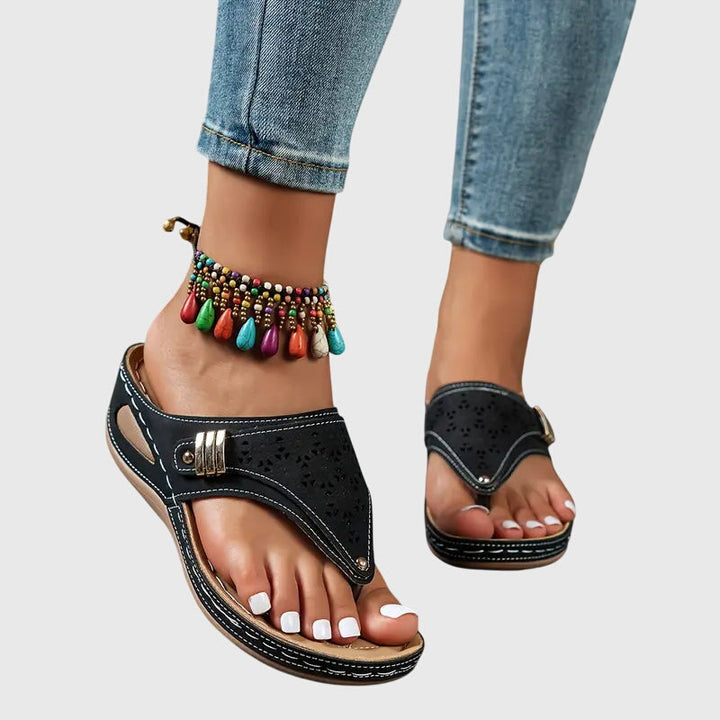 Orthopedic women's sandals, featuring comfortable arch support and a stylish wedge for relief.