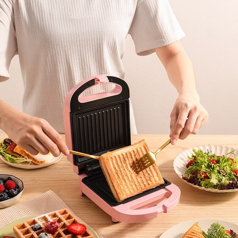 Compact 2-in-1 non-stick sandwich maker & toaster, sleek design, cooks 2 slices, even heating, perfect for small kitchens.