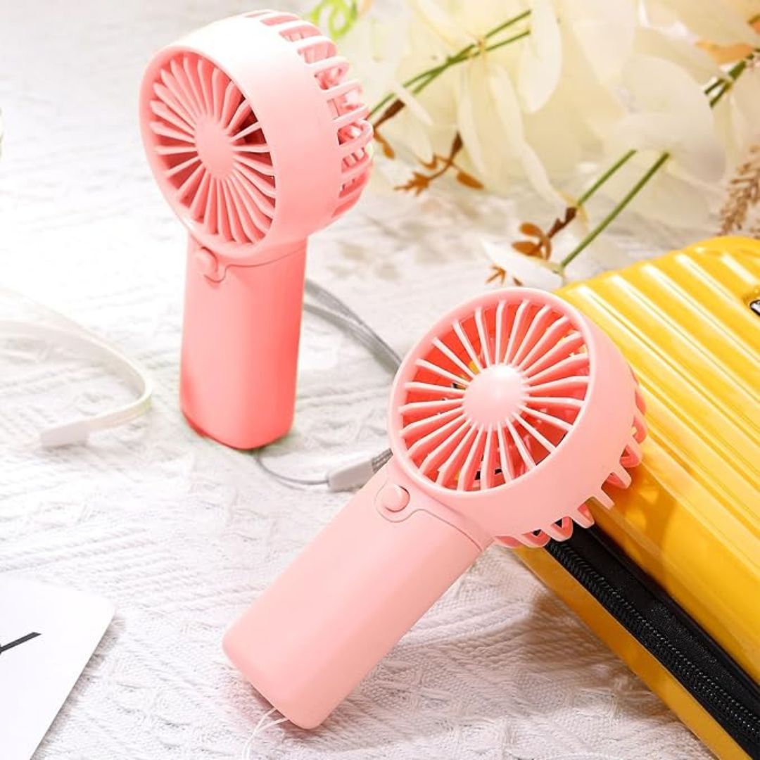 "Compact portable mini fan, sleek design in white, pocket-sized cooler for travel or office, beauty wellbeing essential."