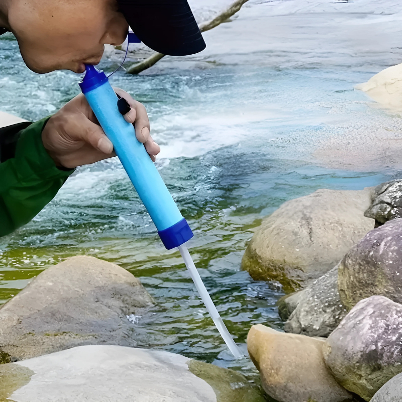 "Compact portable outdoor water purifier, lightweight design, efficient filtration, ideal for hiking and camping use."