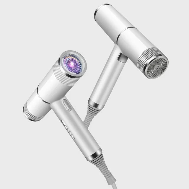 "Compact professional ionic hair dryer with sleek design, diffuser, and concentrator nozzle for salon-quality styling."