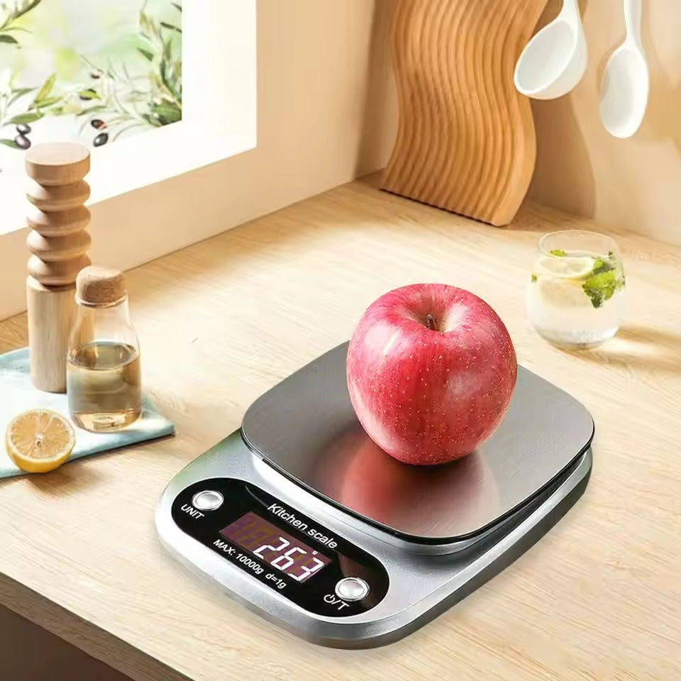 "Compact stainless steel kitchen scale with sleek design for precise 0.1g measurements, ideal for culinary accuracy."