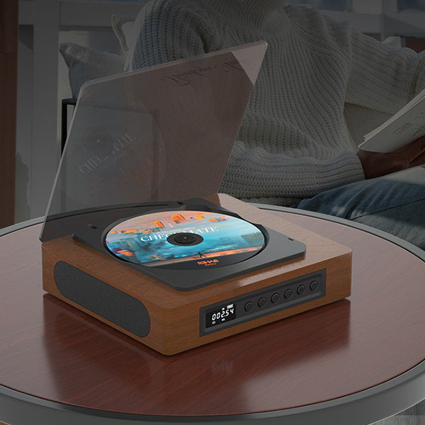 "Compact vintage-style Bluetooth CD player with retro design, FM radio, Bluetooth connectivity, and LCD display for modern us