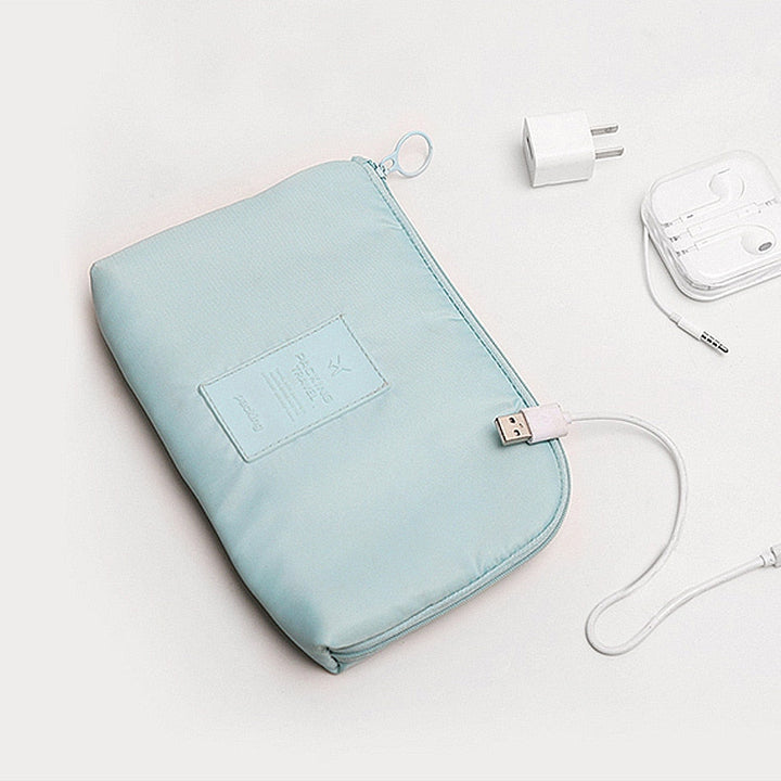 Waterproof electronics travel pouch, providing secure, organized storage for cables, headphones & chargers.