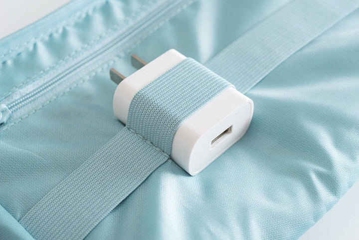Compact tech organizer for travel, a waterproof solution for managing all your essential electronics.