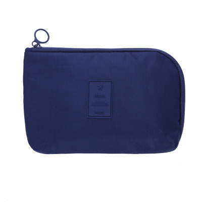 Unisex waterproof travel organizer for electronics, ensuring safe storage of cables & accessories.