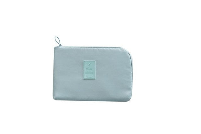 Waterproof travel pouch for electronics, offering secure storage for cables, power banks & small devices.