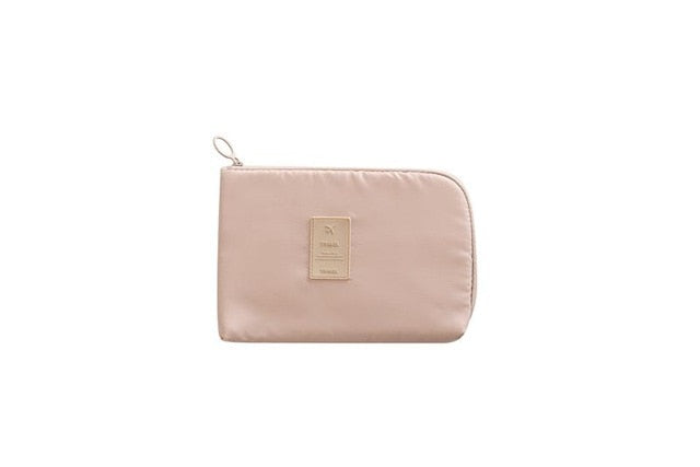 Travel organizer kit: compact waterproof tech bag + mini storage case for chargers & small electronics.
