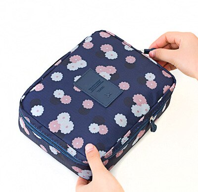Portable women's waterproof makeup travel bag for organized beauty products.