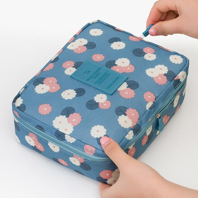 Stylish women's waterproof travel makeup organizer bag, a must-have cosmetic essential.