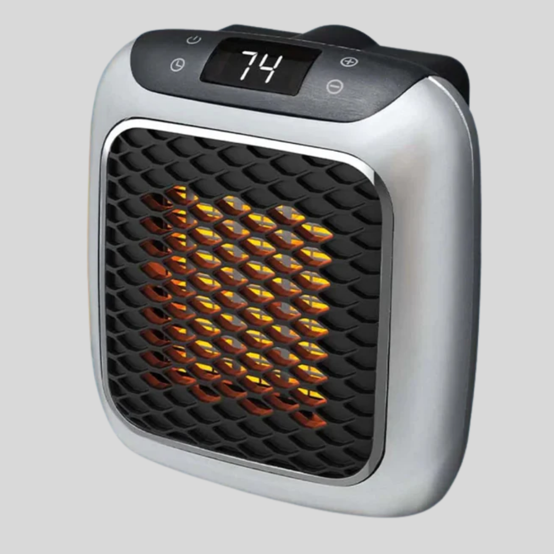 Compact white ceramic personal space heater for desk, office, or small room, providing quick electric warmth.