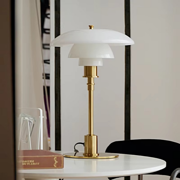 Contemporary Danish designer table lamp with warm LED light, sleek Scandinavian form, amber finish, and premium glass.