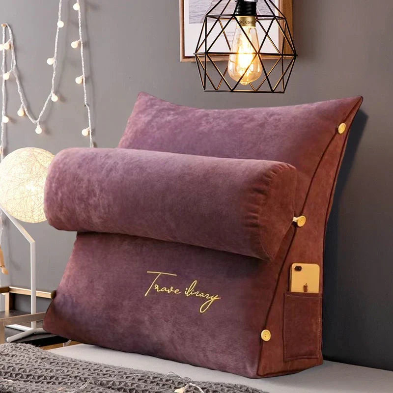 Contoured wedge pillow with ergonomic design, offering back support and a soft fabric cover for comfort and pressure relief.