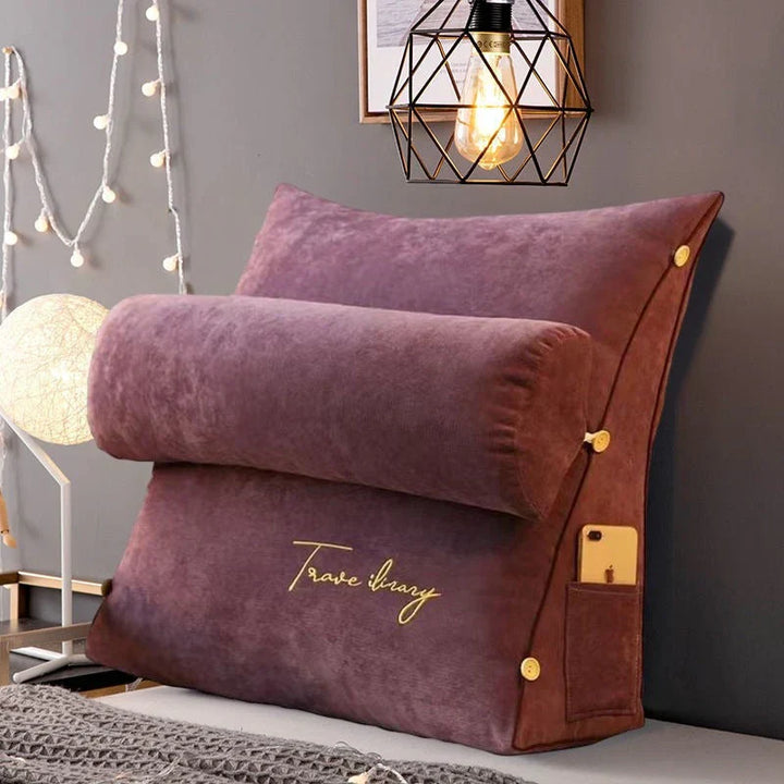 Contoured wedge pillow with ergonomic design, offering back support and a soft fabric cover for comfort and pressure relief.