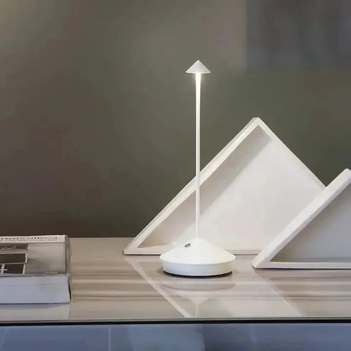 "Cordless rechargeable table lamp, sleek pine-like design, touch control, USB-powered, waterproof, dimmable LED lighting."