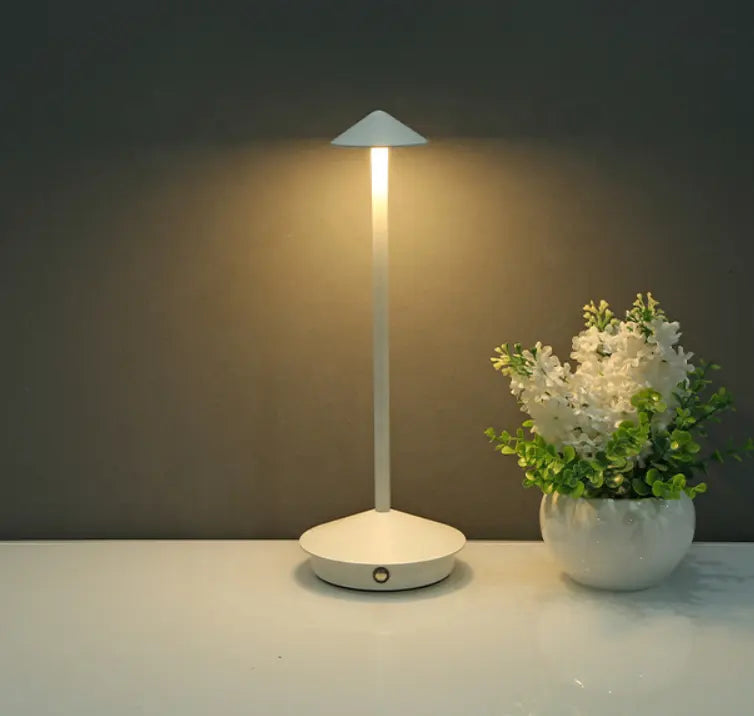 "Cordless rechargeable table lamp, sleek pine-like design, touch control, USB-powered, waterproof, dimmable LED lighting."
