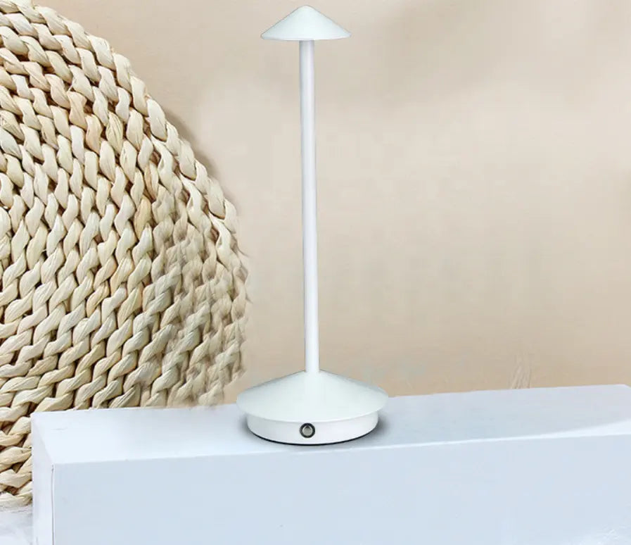 "Cordless rechargeable table lamp, sleek pine-like design, touch control, USB-powered, waterproof, dimmable LED lighting."