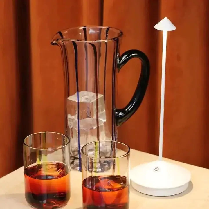 "Cordless rechargeable table lamp, sleek pine-like design, touch control, USB-powered, waterproof, dimmable LED lighting."