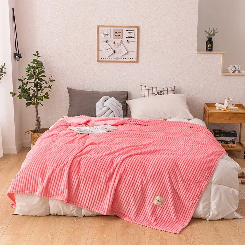 Neatly folded thick flannel throw blanket, ready for cozy comfort on a chilly evening. Soft, warm home decor piece.