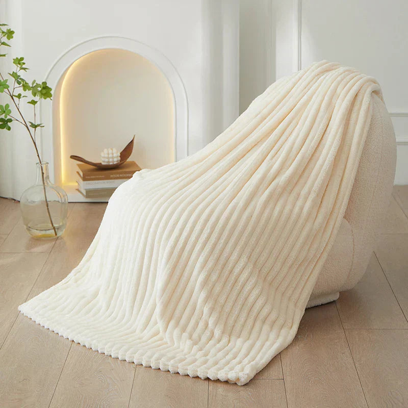Beautiful wide striped flannel fleece blanket, enhancing cozy home decor with warmth.
