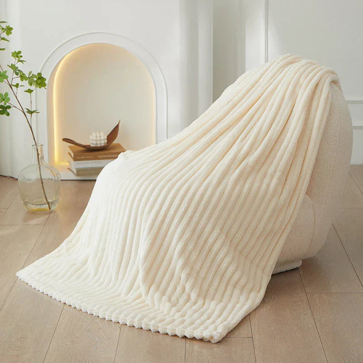 Beautiful wide striped flannel fleece blanket, enhancing cozy home decor with warmth.