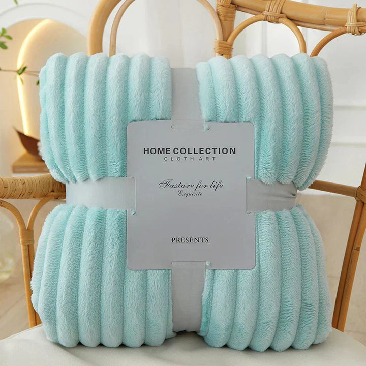 Warm & plush wide-striped fleece comfort blanket. A soft, cozy throw for inviting home decor.